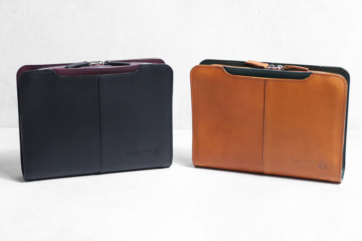 COMPLEX GARDENS / 眼蔵 ゲンゾウ 上質で肉厚なバケッタレザーを贅沢に使用したラウンドジップクラッチバッグ