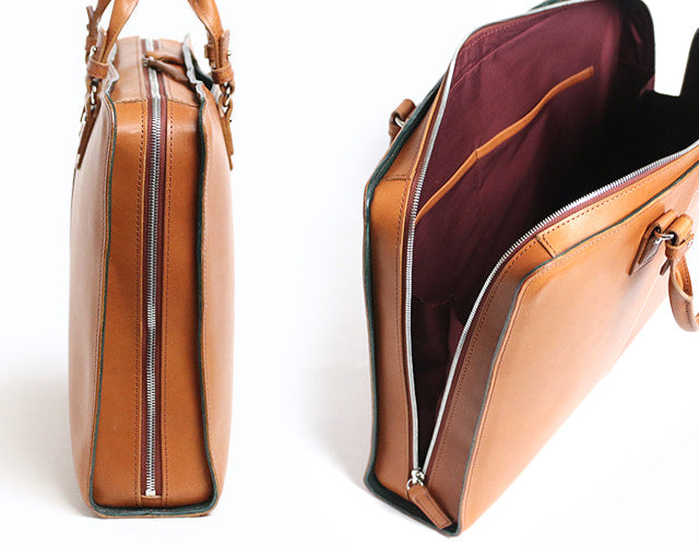 COMPLEX GARDENS / 眼蔵 ゲンゾウ 上質で肉厚なバケッタレザーを贅沢に使用したラウンドジップB4ブリーフケース