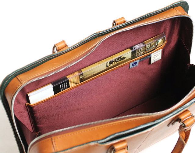 COMPLEX GARDENS / 眼蔵 ゲンゾウ 上質で肉厚なバケッタレザーを贅沢に使用したラウンドジップB4ブリーフケース