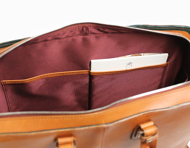 COMPLEX GARDENS / 眼蔵 ゲンゾウ 上質で肉厚なバケッタレザーを贅沢に使用したラウンドジップB4ブリーフケース