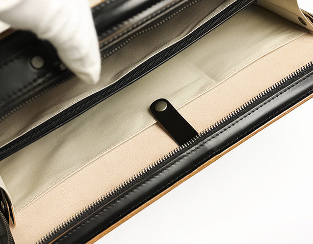 COMPLEX GARDENS / Karatan Transparent cowhide tanned glass round zipper briefs