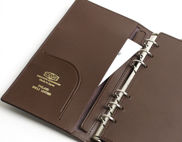 CRAMP / Ikenohata Ginzaten Brass front metal fittings are accented. Bible-sized system notebook with variable pen insertion 